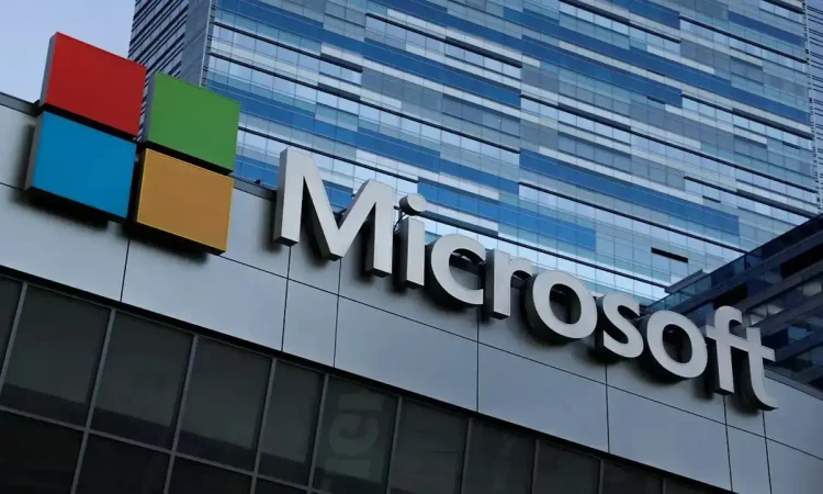 Microsoft headquarters building with overlay text “AI Layoffs” symbolizing the company’s shift to artificial intelligence and workforce reduction