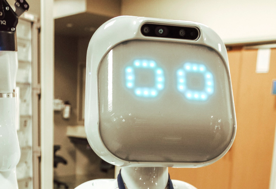 Moxi robot by Diligent Robotics delivering medical supplies in a hospital hallway