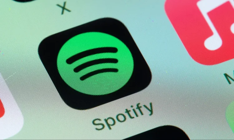 Spotify logo with user data icons, representing the sale of listening data to AI developers