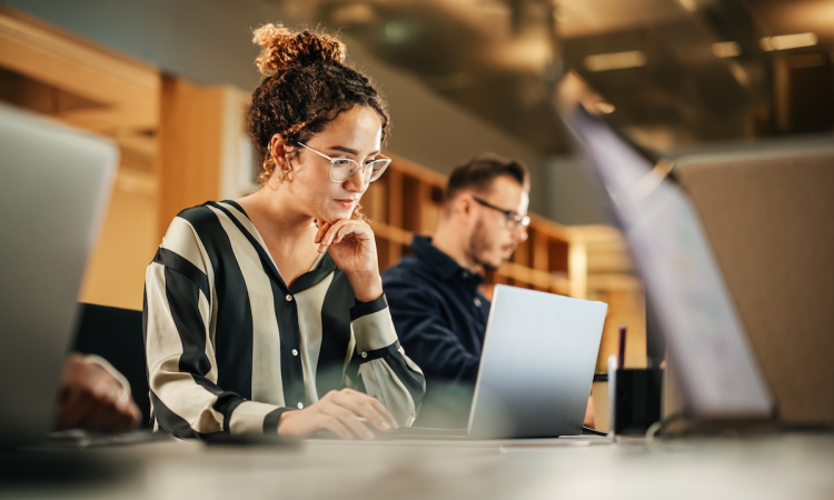 Young workers facing AI eliminating jobs while new opportunities emerge, highlighting Stanford study on workforce impact