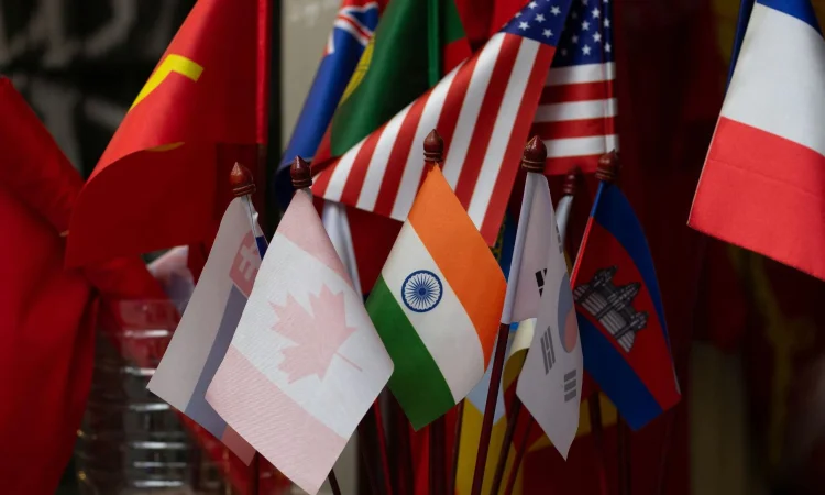 People reading global headlines illustrating 2025’s most impactful news stories