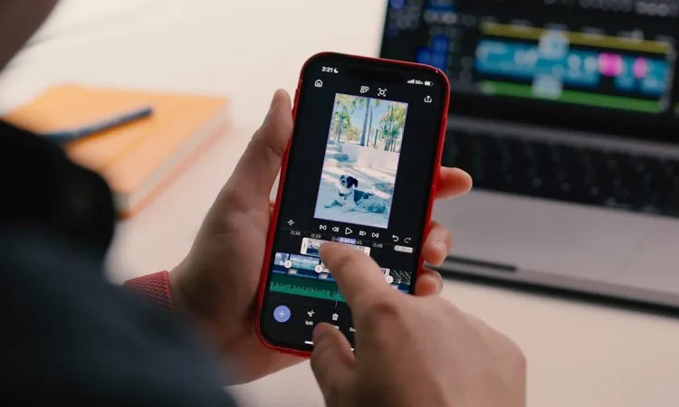 Screenshot of Adobe Premiere app interface on iPhone showing video editing timeline and tools