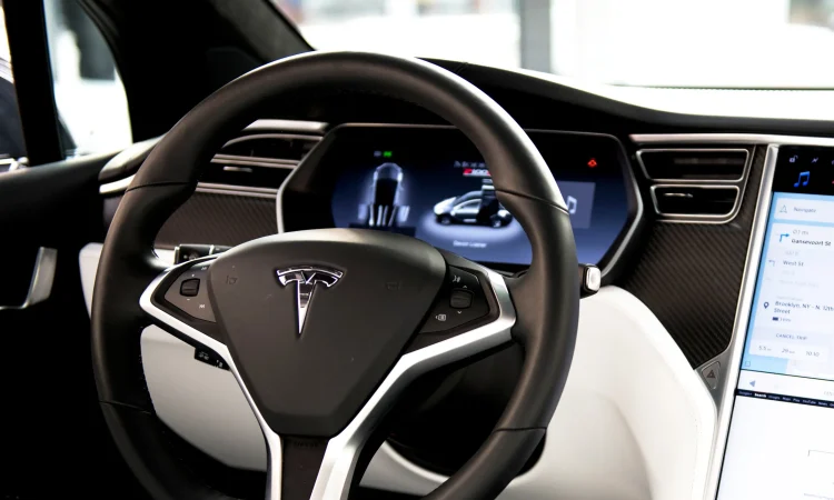 Tesla vehicle using Full Self-Driving software navigating an unmarked road with enhanced neural network technology